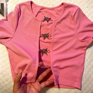 Light pink open front top with butterflies as buttons that do not open